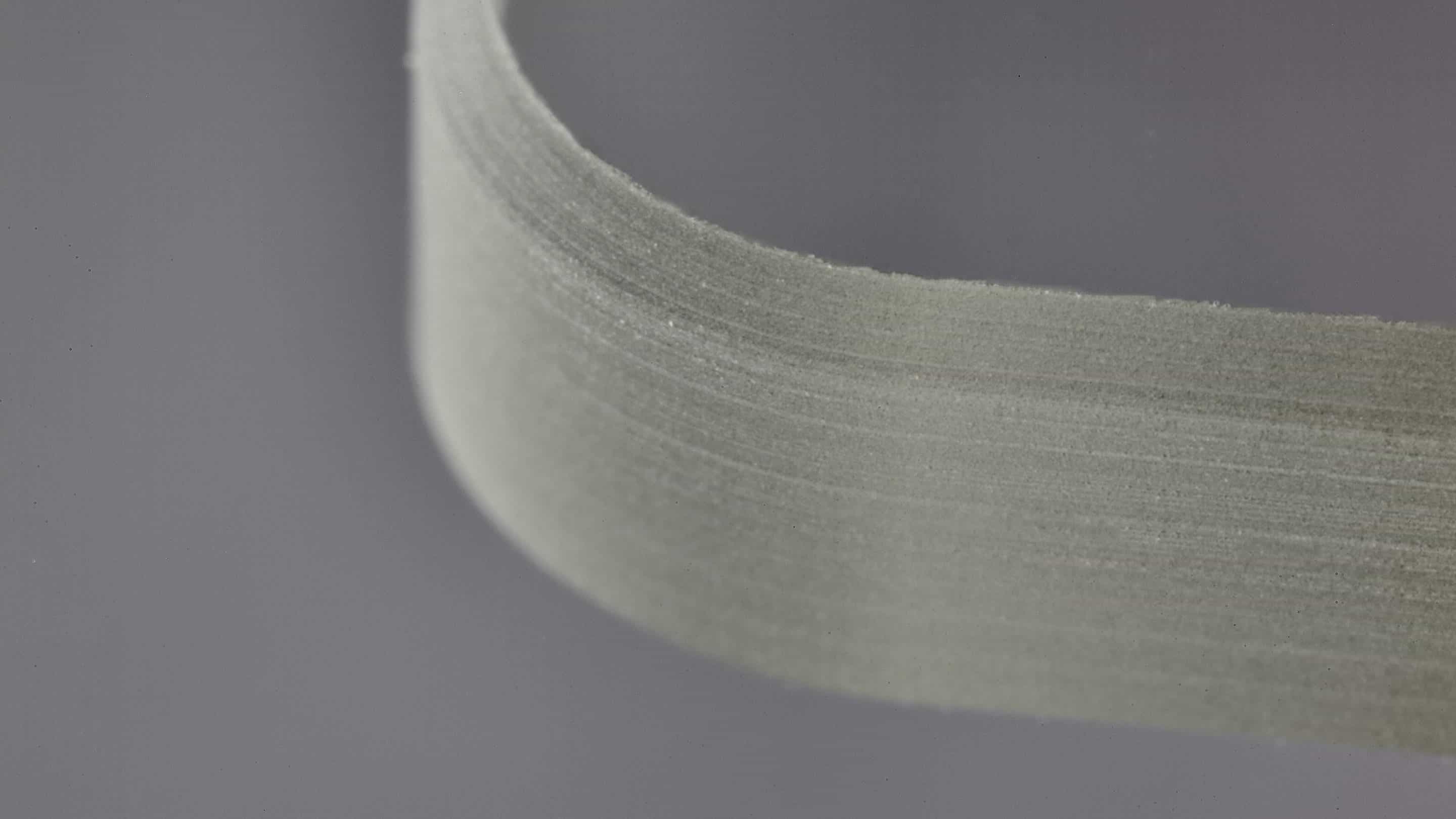 Impactinator® Glass - Cut glass edge a close-up of a tape