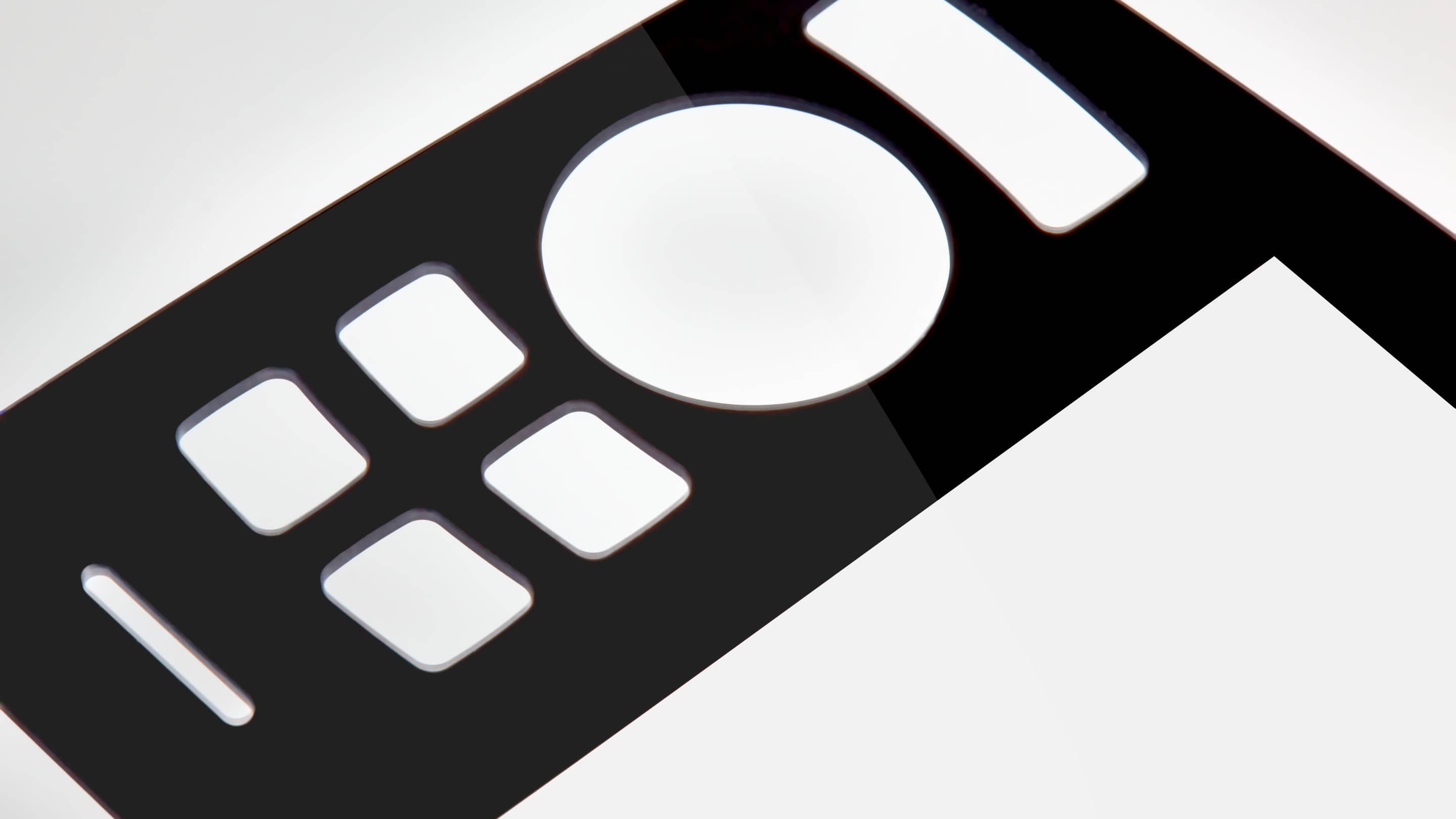 - Glass Pure Beauty a close up of a remote control