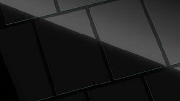 Impactinator® Glass - Kính kỹ thuật, một vật thể hình chữ nhật màu đen với các đường màu xanh lam