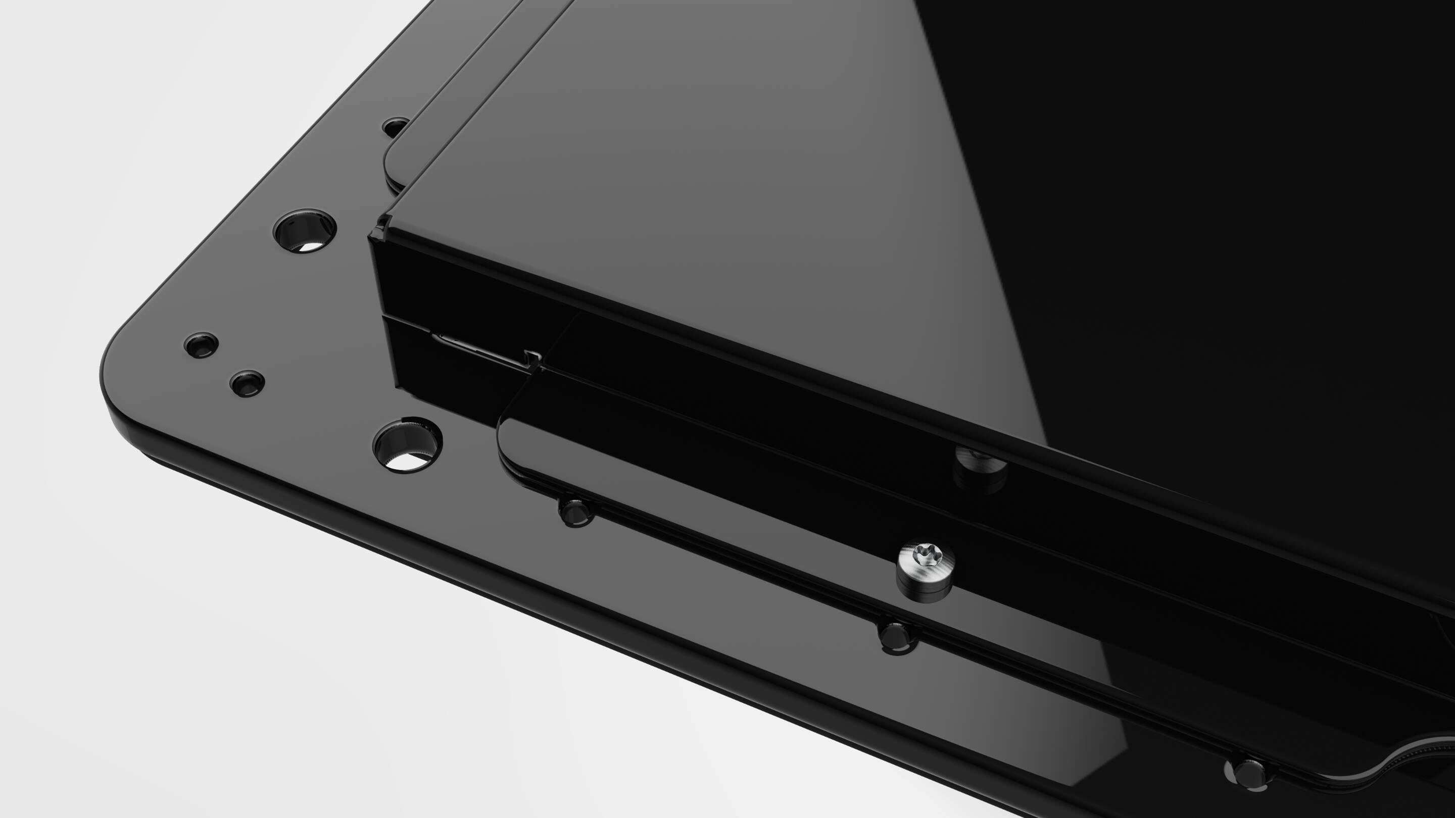 Développement - Open Frame Case Black Detail un objet rectangulaire noir avec vis