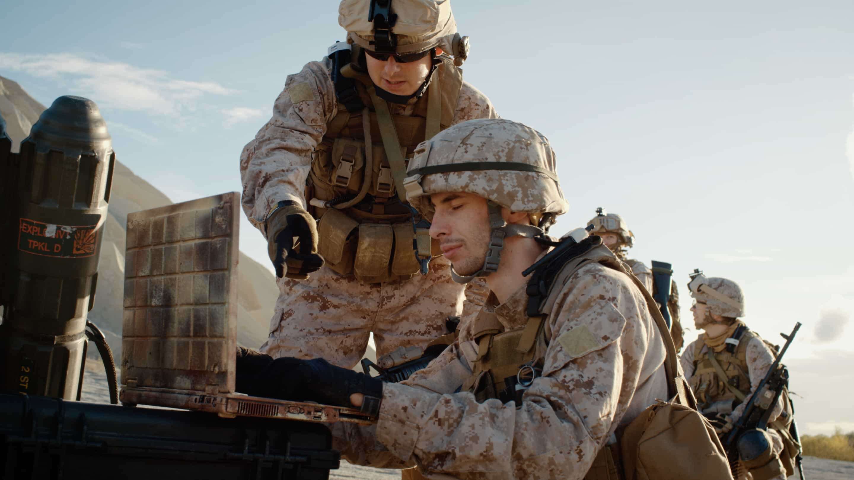 Military - Military a group of soldiers looking at a computer