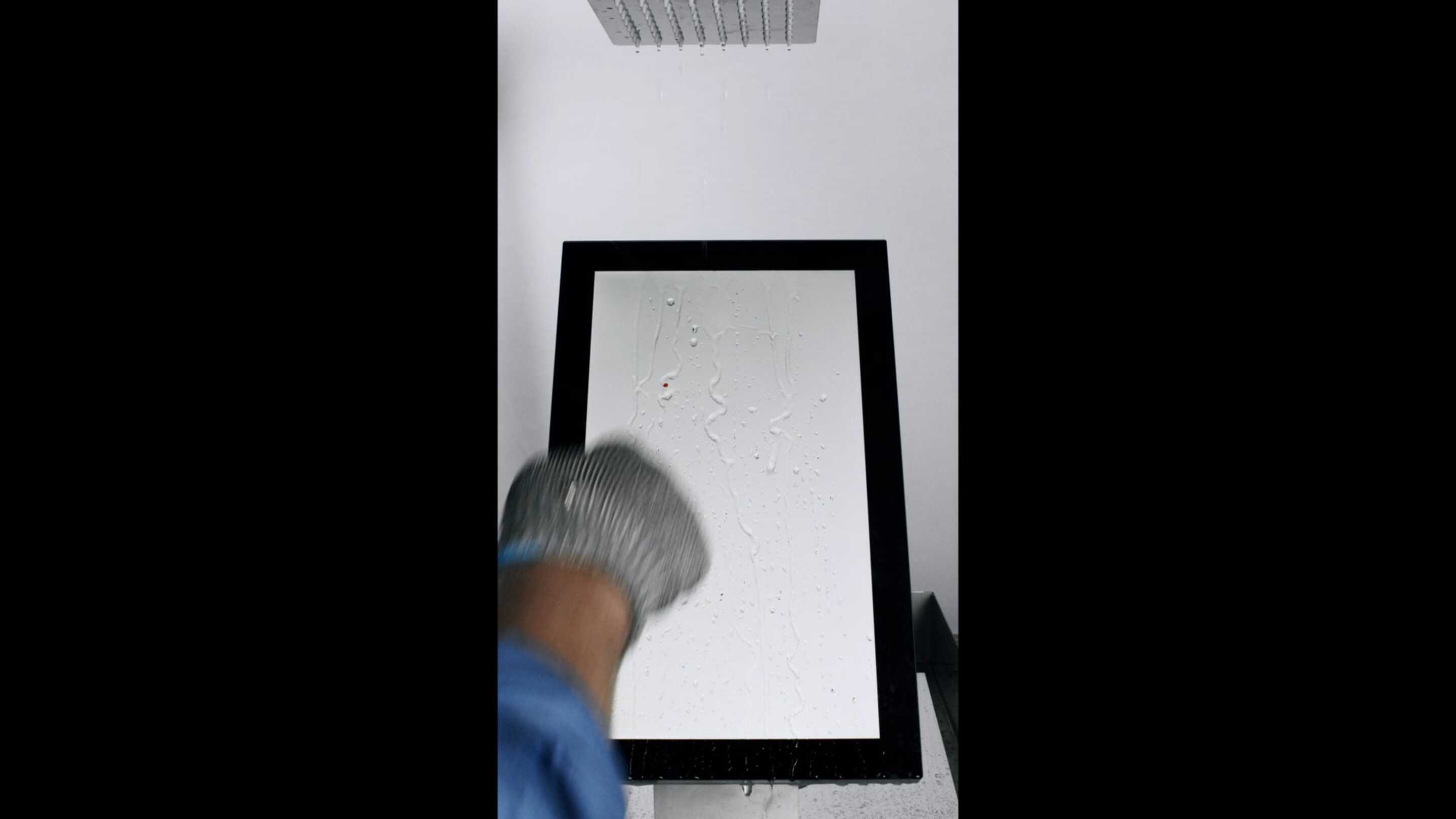 Water Performance Test a hand with glove and a screen