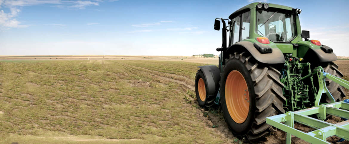 Agriculture - Tractors a tractor in a field