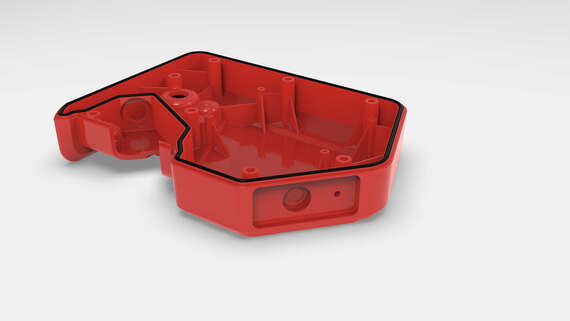 Manufacturing - Fip Seals a red plastic object with black lines