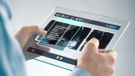 Start-Ups - Instant Prototyping hands holding a transparent tablet